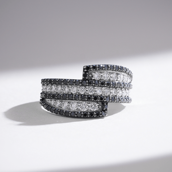 White gold spiral ring with triple rows of white diamonds framed by black pavé diamonds for a bold contrast effect.
