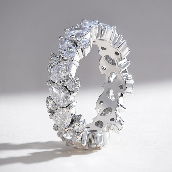 Front view of the Celestial 3 Ct Pear & Round Eternity Band showcasing alternating pear-shaped and round diamonds in a continuous design.