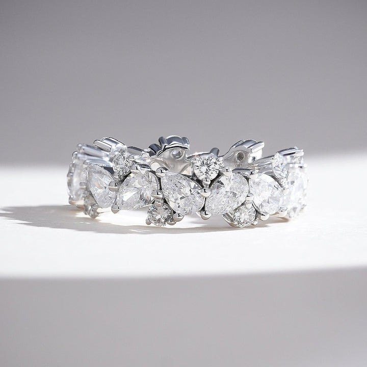 Side view of the Celestial 3 Ct Pear & Round Eternity Band highlighting the intricate diamond setting