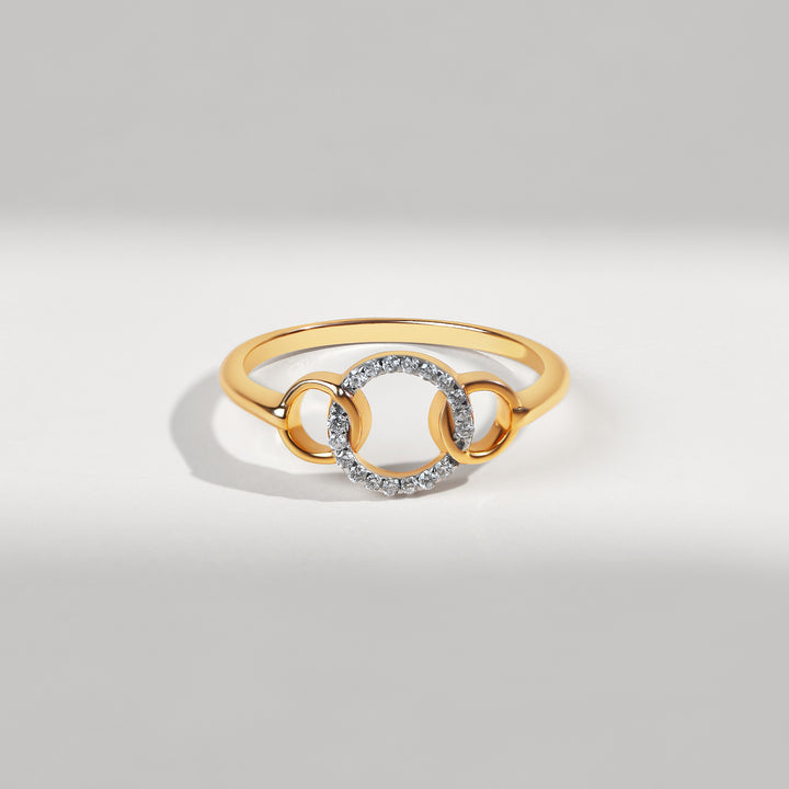 Gold ring with three interlinked circles, central circle set in diamonds, front view.