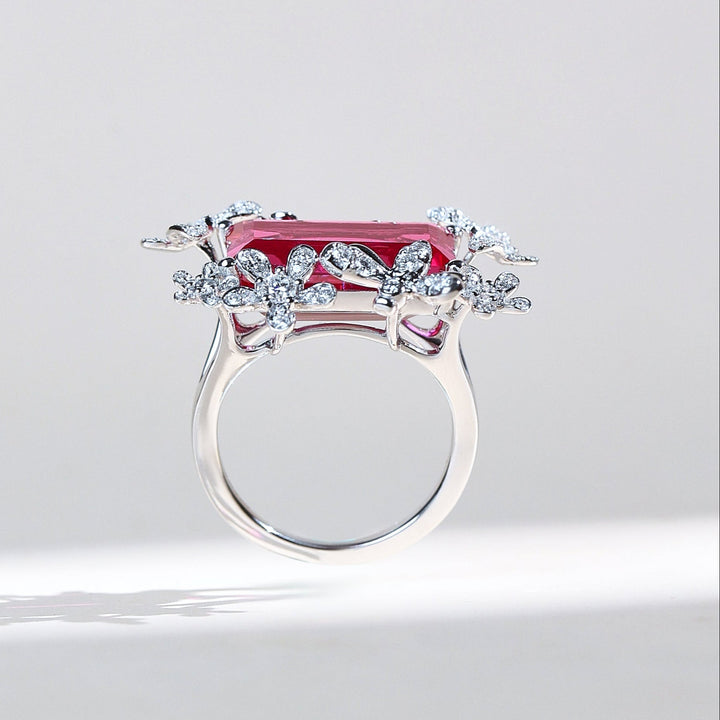 Side profile of Crimson Fleur vintage ruby ring with diamond blossoms