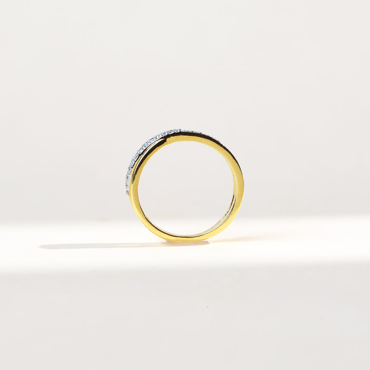 Profile view of Crossroads Dailywear Ring showing slim gold band and diamond arc