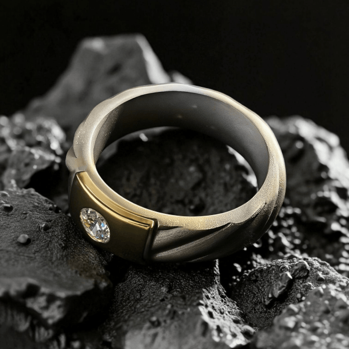 Top-down view of Czar Titanium Ring showing twisted titanium detail and flush diamond setting in gold shot on rocky base