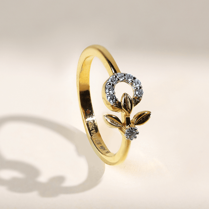 Side view of the Dandelion Dailywear Ring highlighting the raised diamond circle and gold leaves.