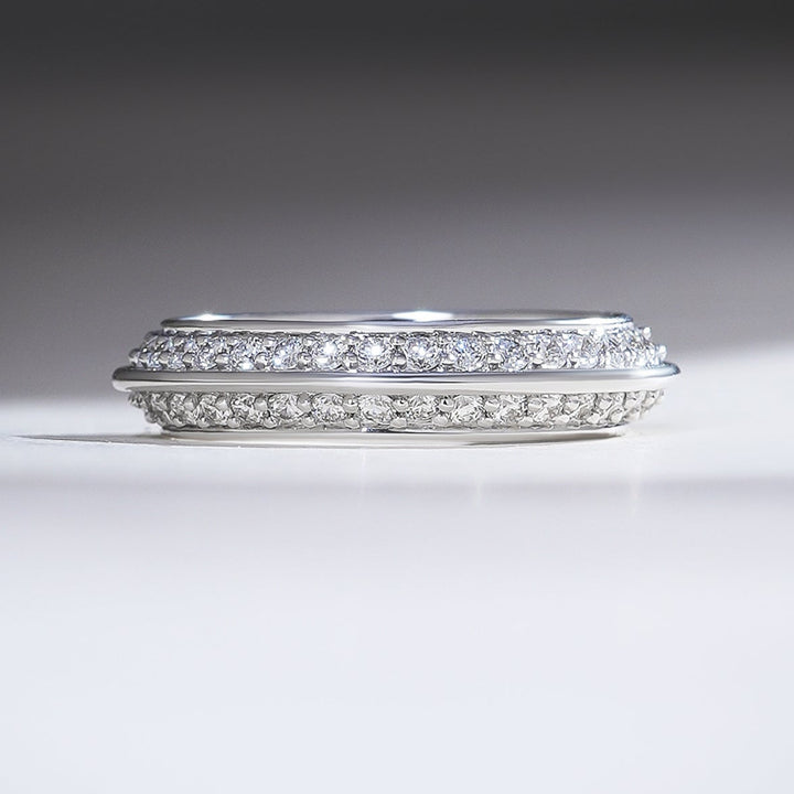 White gold band with double rows of pavé-set diamonds framed by a sleek polished edge for a modern finish.