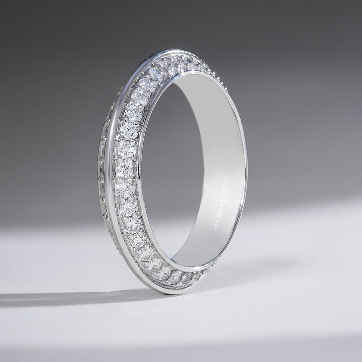 Standing profile of white gold diamond band with dual pavé rows and a polished outer rim.