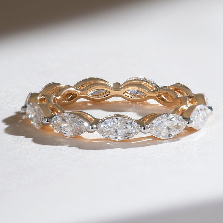 Angled shot of the East and West Marquise 2 Ct Eternity Band highlighting diamond brilliance and unique setting pattern.