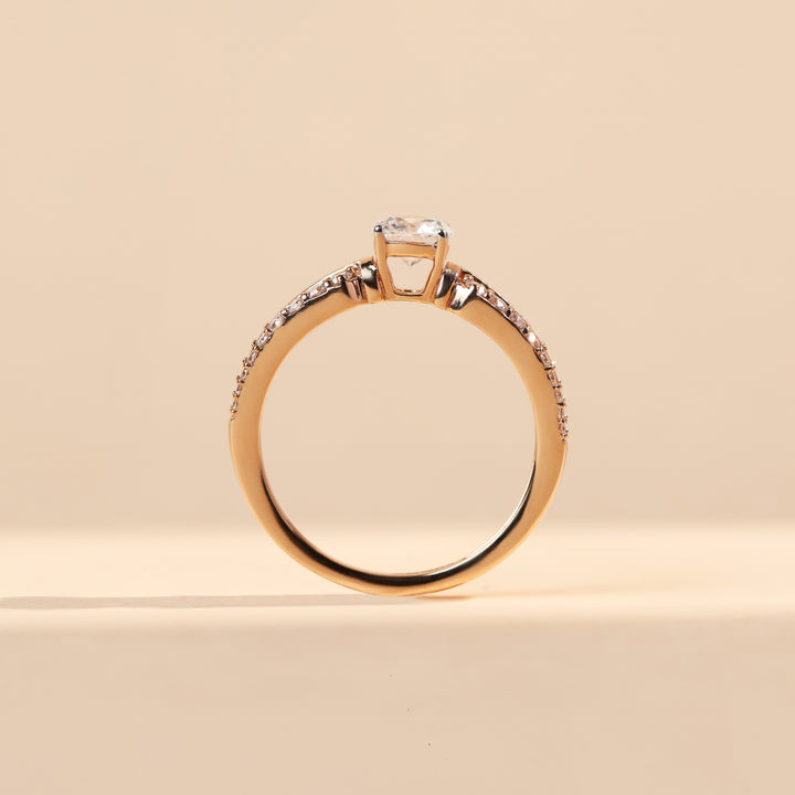 ide profile of Elaris 0.5 Ct Solitaire Ring with elevated round diamond and slim pavé-set shank.