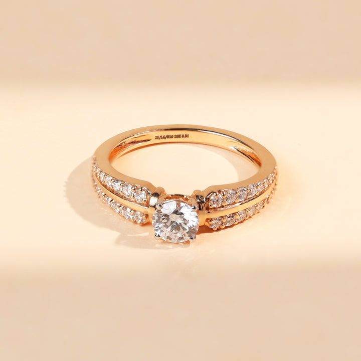 Top view of Elaris 0.5 Ct Solitaire Ring featuring a 0.5 carat round diamond with pavé accents on both sides.
