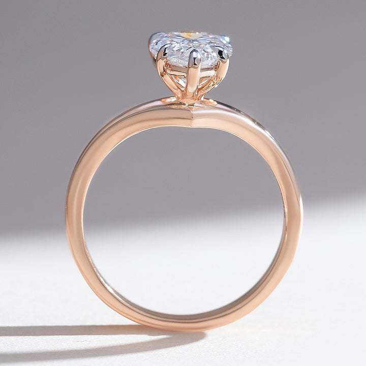 Profile view of Elowen pear solitaire ring highlighting the pear diamond and prong setting.