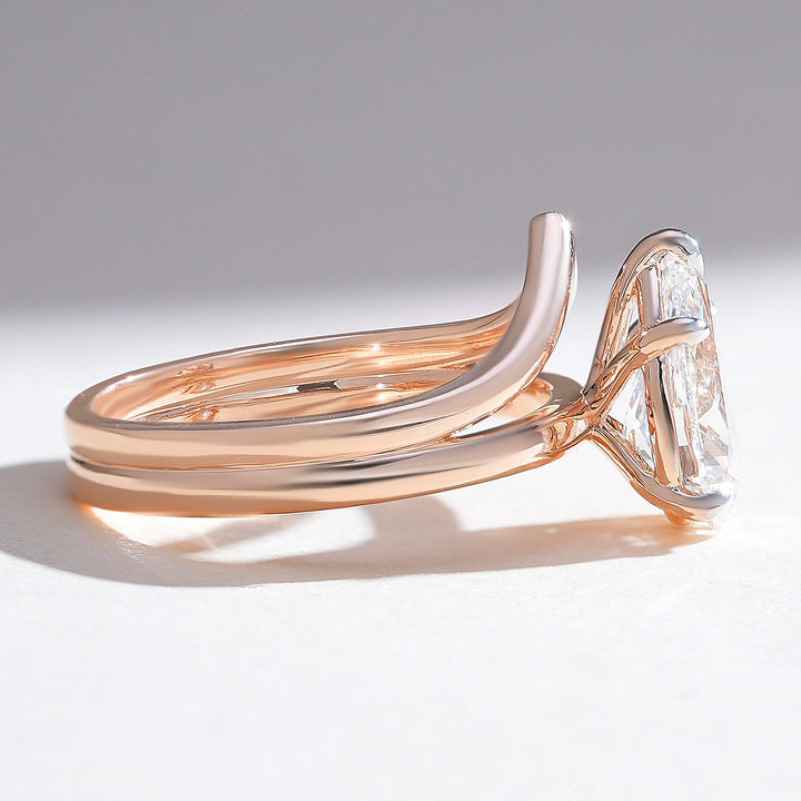 Side view of Elowen pear solitaire engagement ring showing delicate band and elevated setting
