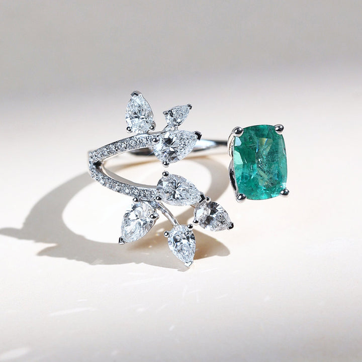 Top view of Emerald Vine cocktail ring with emerald center stone and diamond leaf motif