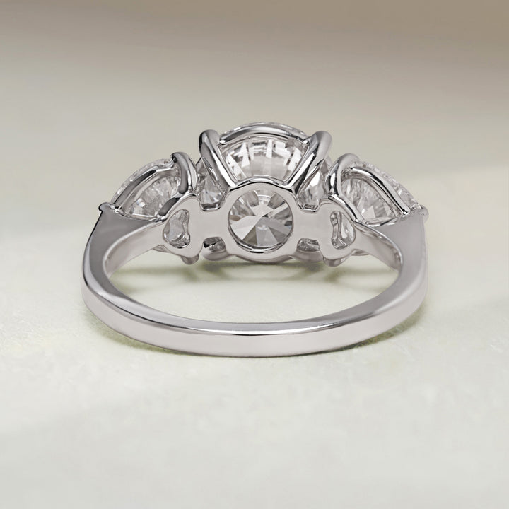Back view of Evermore 3.5 Ct Three Stone Ring highlighting basket setting and polished white gold band.