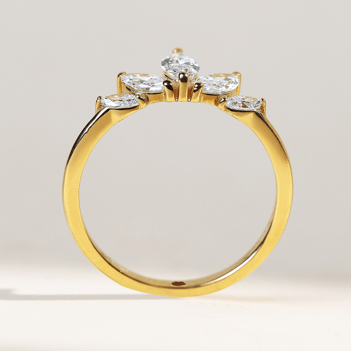 Profile view of 0.7 Ct Five Petal Flora Ring highlighting slim gold band and floral diamond setting.
