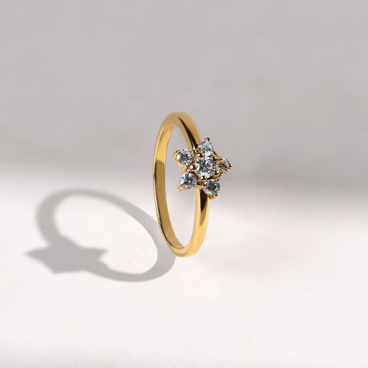 Side angle of Floral Bloom 0.2 Ct Dailywear Ring in yellow gold with star-shaped floral cluster.
