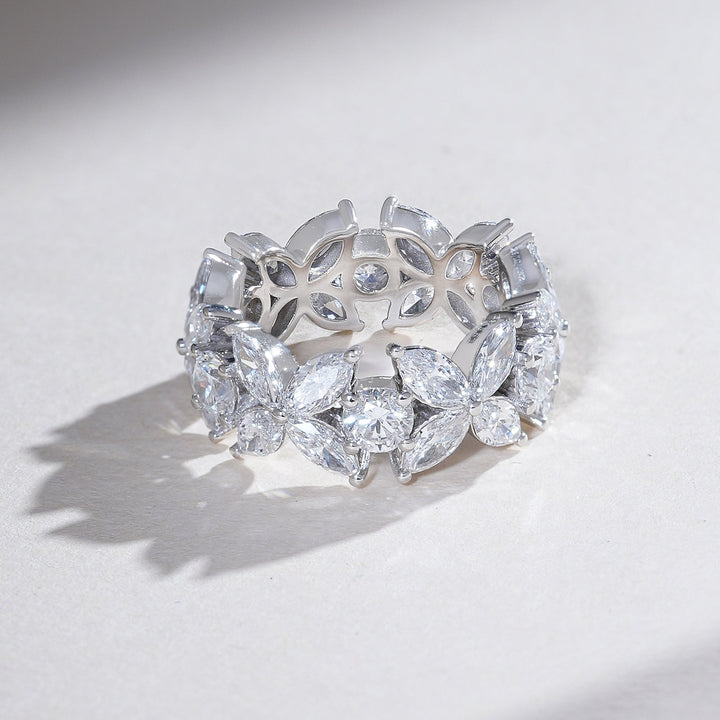 Angled shot showing the detailed lattice design and sparkle of the marquise and round diamonds in the Flower Bow Eternity Band