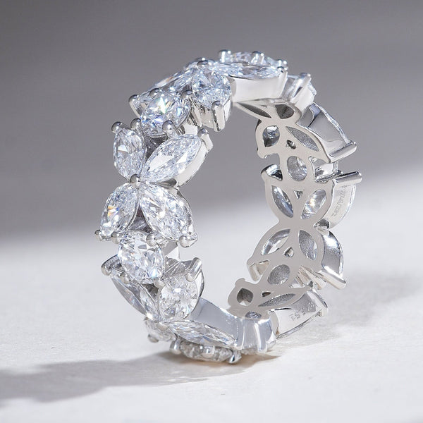 Side view highlighting the intricate bow-inspired floral pattern of the Flower Bow Eternity Band with marquise and round diamonds.