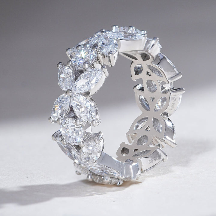 Side view highlighting the intricate bow-inspired floral pattern of the Flower Bow Eternity Band with marquise and round diamonds.