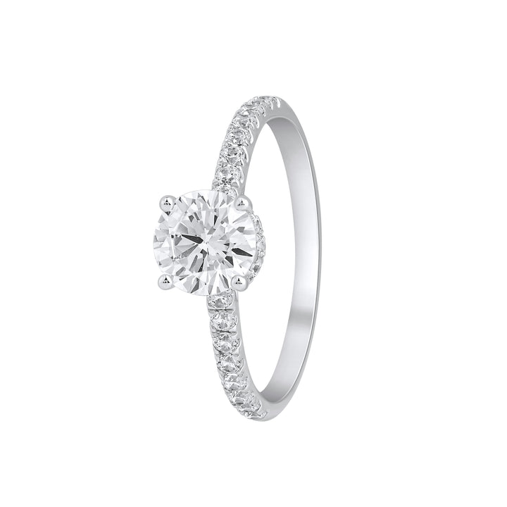 Angled view of Forever Ring showing the pear solitaire and pavé-set diamonds along the band.