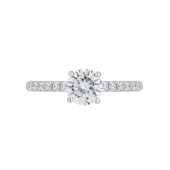 Front view of Forever Ring featuring a 0.8 carat pear-shaped solitaire diamond with pavé band in white gold.