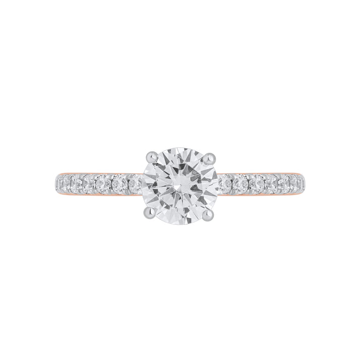 Front view of Forever Ring featuring a 0.8 carat pear-shaped solitaire diamond with pavé band in yellow gold.