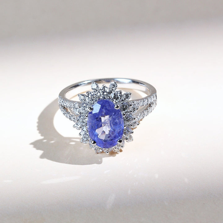 French Riviera Iconic Cocktail Ring with vivid blue center stone and diamond halo