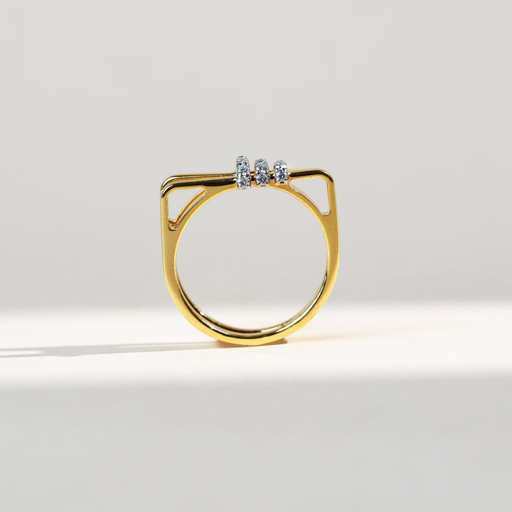 Side profile of geometric gold ring with triple diamond bar design