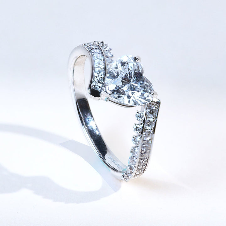 Side angle of Glowing Heart 1 Ct Solitaire Ring featuring prong-set heart-shaped diamond.