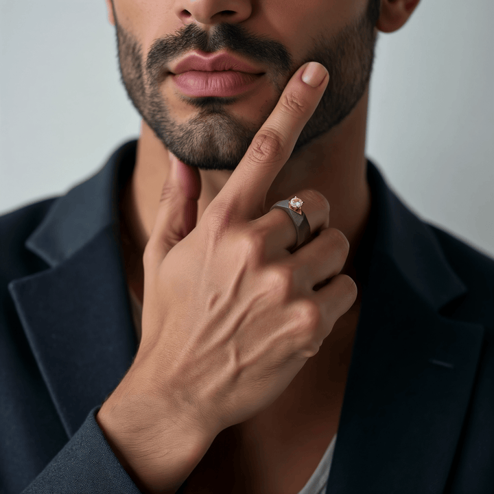 Man wearing the 0.5 Ct Helios Titanium Ring, featuring a faceted titanium band with yellow-gold solitaire setting, styled with a blazer — lifestyle view.