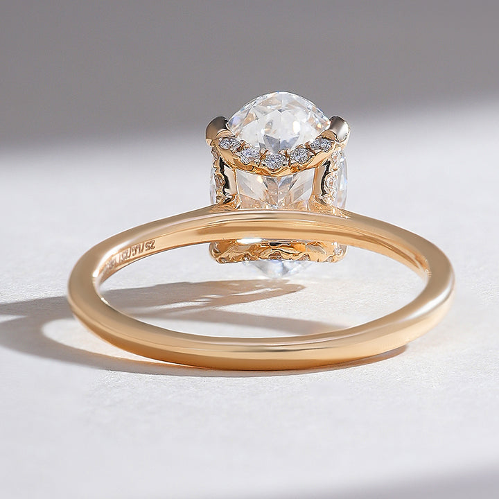 Rear view of the yellow gold Hidden Harmony 2 Ct Oval Solitaire Ring, highlighting the gallery details.