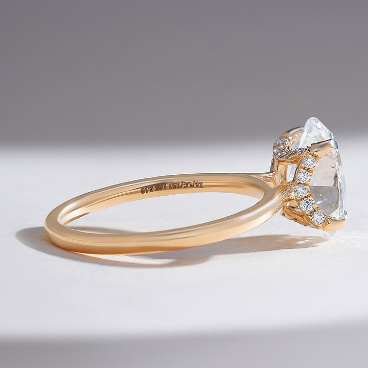 Side profile showing the hidden halo design beneath the 2 carat oval diamond on the Hidden Harmony Solitaire Ring.