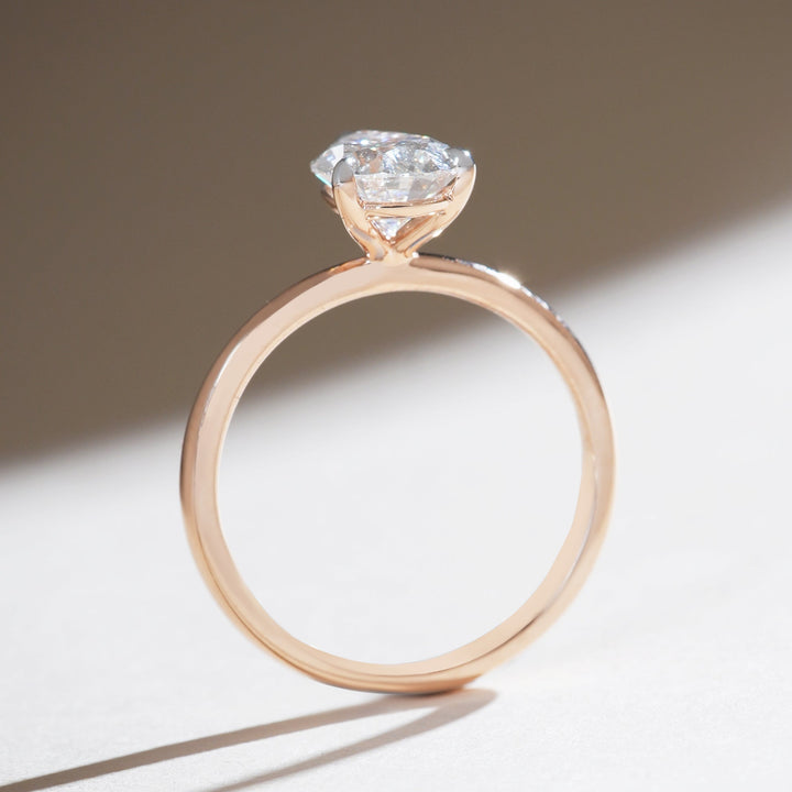 Profile view of the Iconic 1.5 Ct Pear Solitaire Ring showing the diamond’s height and prong detail.