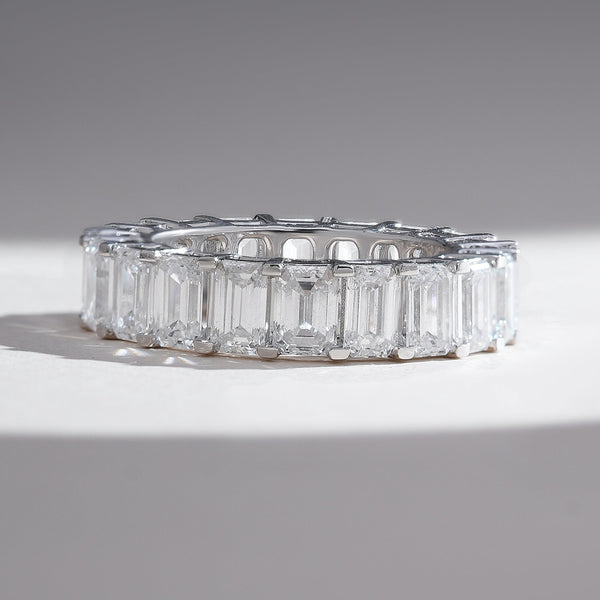 Front view of the Iconic 6 Ct Emerald Eternity Band showcasing flawless emerald-cut diamonds set in white gold.