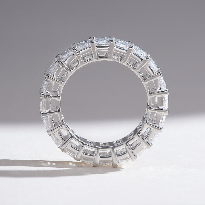 Perfectly round profile shot of the emerald-cut eternity band with seamless craftsmanship