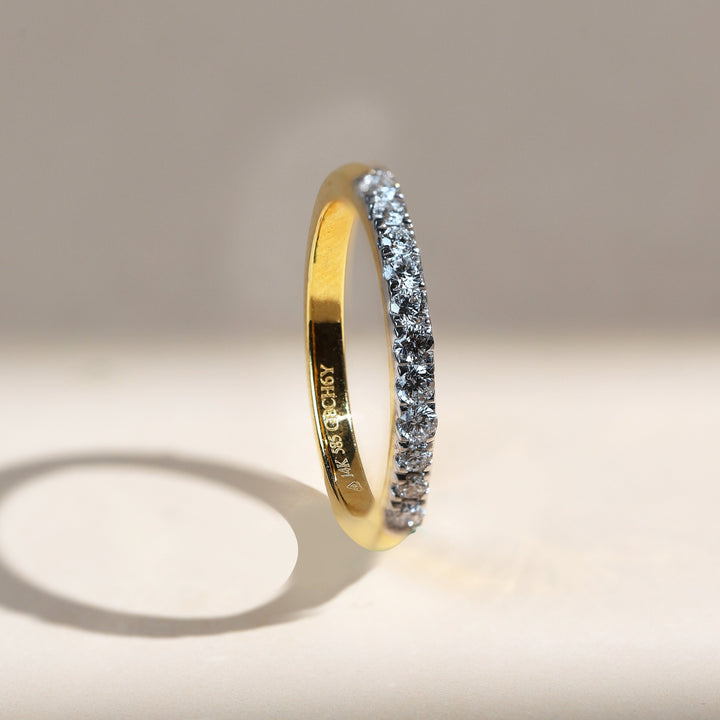 Angled view of Iconic 0.3 Ct Half Eternity Band showcasing diamond sparkle