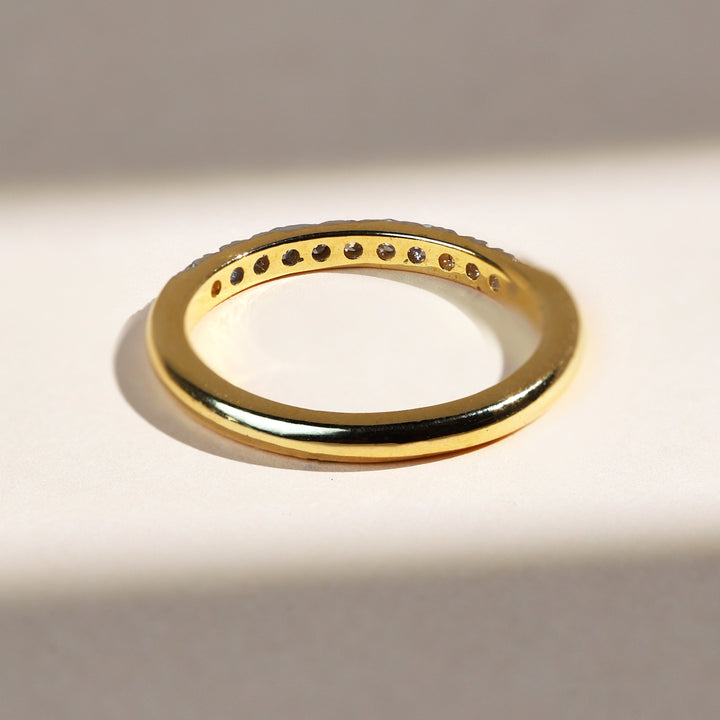 Back view of Iconic 0.3 Ct Half Eternity Band in polished yellow gold.