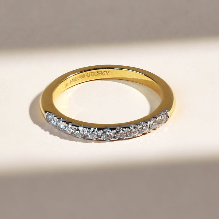Front view of Iconic 0.3 Ct Half Eternity Band in yellow gold with half-set round diamonds