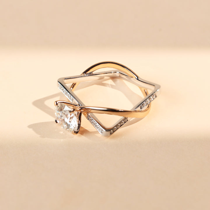 Angled view of Illusion 2 Ct solitaire ring featuring round solitaire and diamond-accented twisted band.
