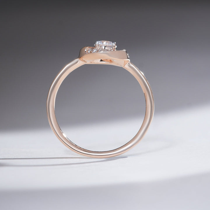 Slim rose-gold band with pavé halo around a 0.3-ct round diamond, side profile.