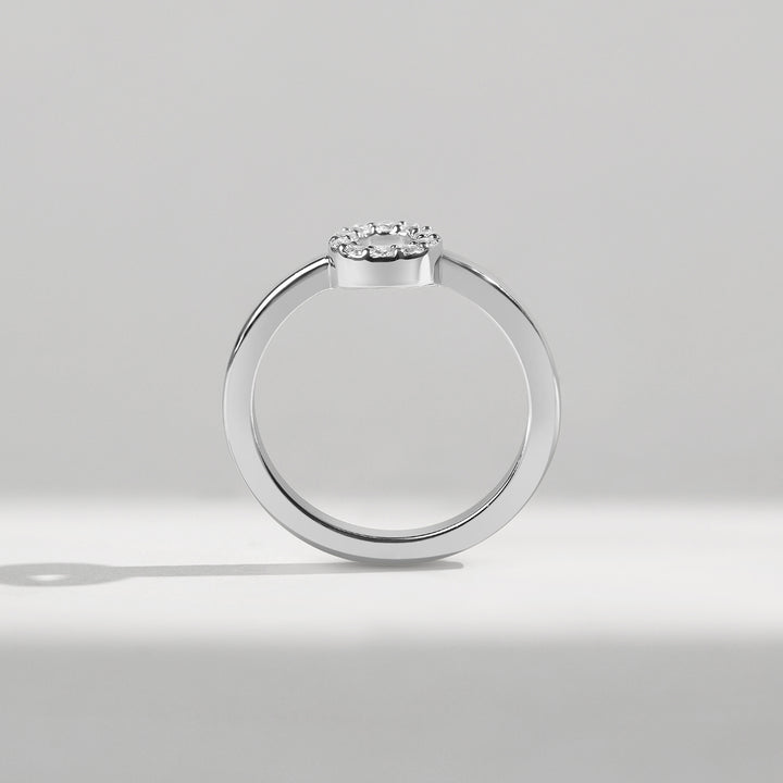 Side profile of 0.1 Ct Little Halo Ring showing sleek white gold band.
