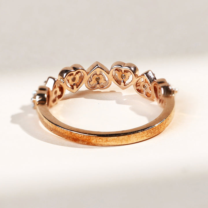Back view of rose gold ring showing hollow heart mounts