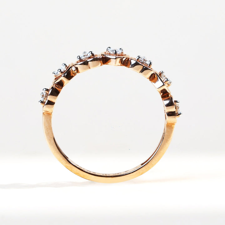 Upright view of rose gold heart ring with diamond accents