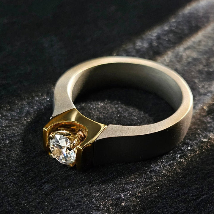 Angled shot of 0.5 Ct Obsidian Flame Titanium Ring on dark background.