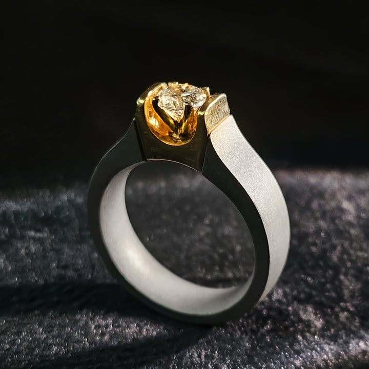 Front view of 0.5 Ct Obsidian Flame Titanium Ring with gold bezel and titanium band.