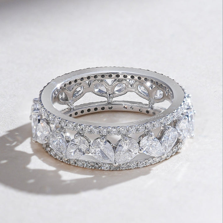 Angled view showcasing the sparkle of the Pear Eternal Forever 3 Ct Eternity Band.
