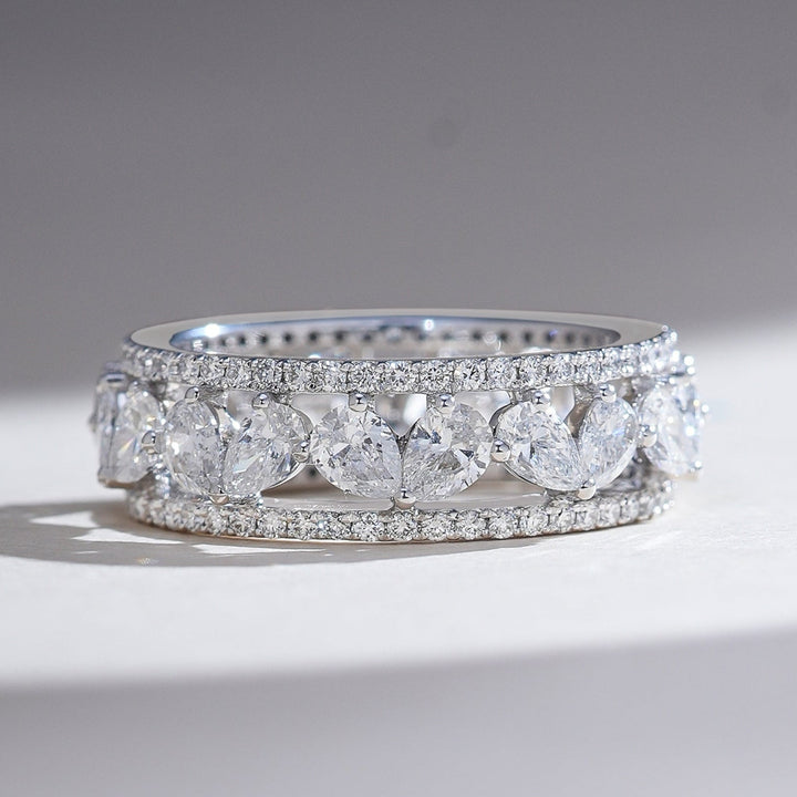 Front view of Pear Eternal Forever 3 Ct Eternity Band with pear-cut diamonds in a continuous halo setting