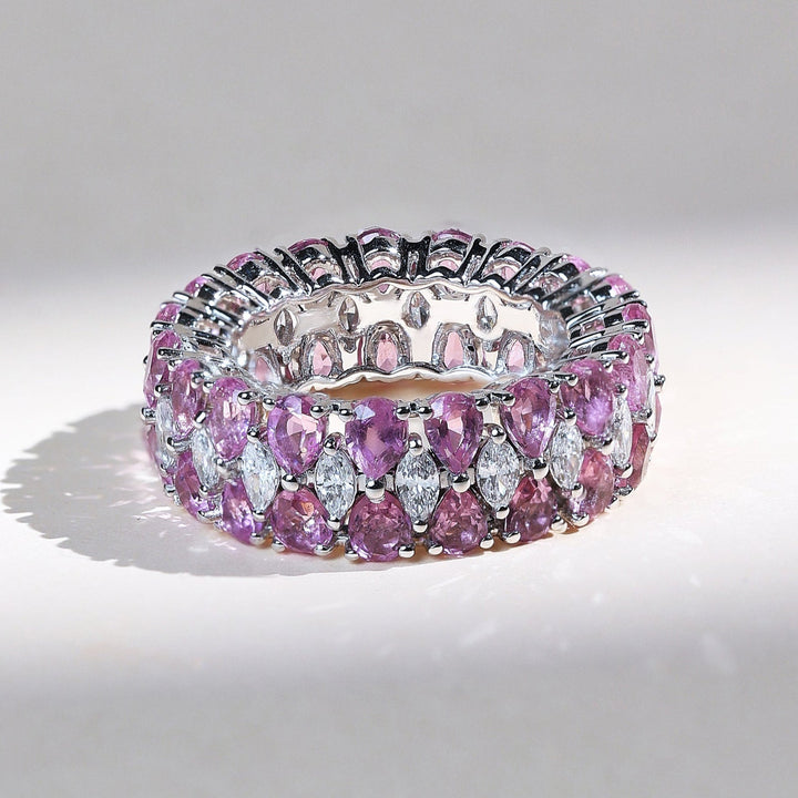 Pink pear and marquise eternity band with alternating diamonds and pink gemstones in white gold