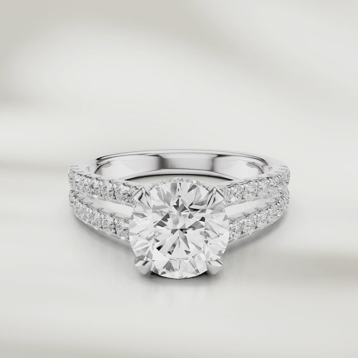 360degree video of 1 Ct Eira Solitaire Ring in white gold, its round brilliant diamond catching the light with every movement. 