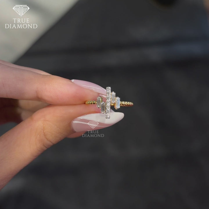 Close-up video of the Diamond Rhythm Beaded Ring rotating under soft light, highlighting its gold bead band and diamond arrangement.