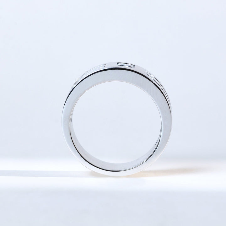 Profile view of Prince men’s solitaire ring in white gold showcasing its bold band and diamond.